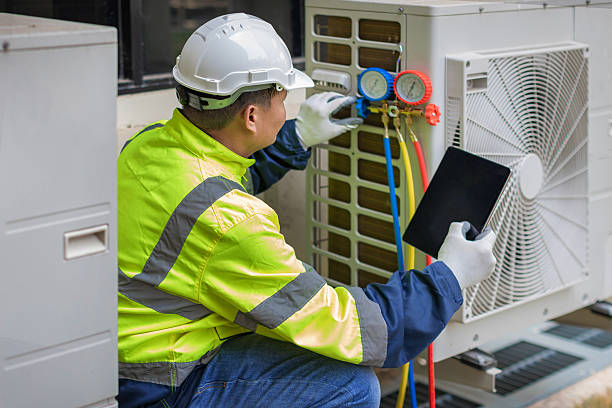 Professional Hvac technician working in Ames, TX